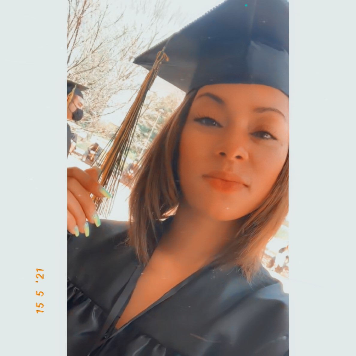 Chantel Baker in a graduation cap after graduation