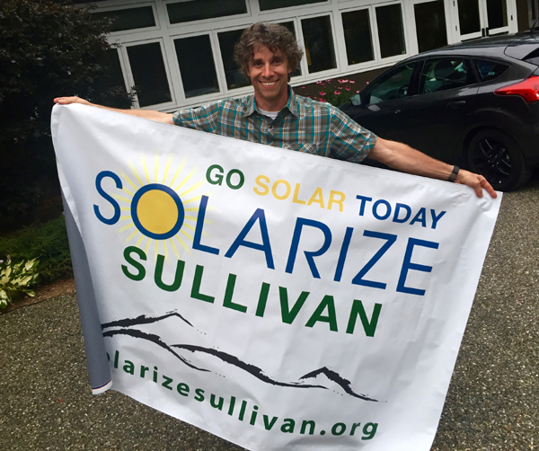 Man holding solarize banner
