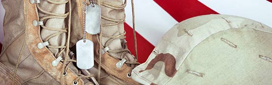 Dog tags hanging on boot with helmet