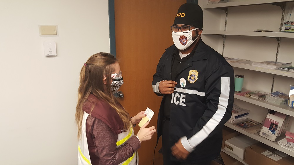 Tiffany Kahn, RN, gives Fallsburg Police Chief Simmie Williams the #SullivanSafe sticker after getting the COVID-19 vaccine.